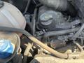 The image shows the engine compartment of a 2016 Mercedes-Benz Sprinter with visible hoses and components including an oil cap and a coolant reservoir