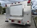 2010 Ford F-550 Super Duty with a diamond plate rear and a roll-up door at the back