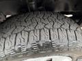 Close-up of a tire on a 2017 Ford Transit T150 XLT showing detailed tread pattern and rubber surface