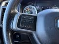 Close-up of a steering wheel with controls for phone and voice recognition on a 2021 RAM 5500