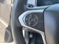 Close-up of the steering wheel controls in a 2017 Chevrolet Colorado featuring buttons for cruise control and audio settings