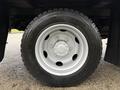 Close-up of a silver alloy wheel with a black tire on a 2015 Hino 195 truck