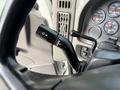 Close-up of the turn signal stalk on the steering column of a 2008 International 4300 featuring controls for turn signals and dashboard lights