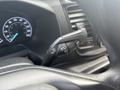 2021 Ford Transit-350 dashboard showing control lever with symbols for windshield wipers and turn signals