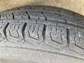 Close-up of a worn tire tread from a 2008 Wells Industries Inc EW1422 showing intricate patterns and grooves