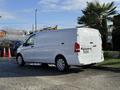 A 2020 Mercedes-Benz Metris van in white with a sleek design and large cargo area visible from the side