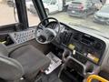 Interior view of a 2022 Freightliner B2 showing the steering wheel dashboard controls and driver's seat