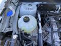 Close-up of the engine bay of a 2023 Ford Bronco Sport featuring a coolant reservoir and various engine components