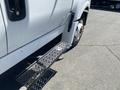 A 2014 International TerraStar truck showing the side steps and wheel with visible bolts and tread pattern