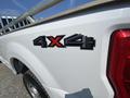 Close-up of a 2017 Ford F-250 SD showing the 4X4 emblem on the side of the truck