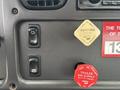 Dashboard controls of a 2013 Freightliner 114SD including buttons for regeneration and mirror heat alongside an air supply indicator