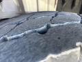 Close-up of a worn tire tread of a 2007 Freightliner M2 106 showing cracks and grooves in the rubber surface
