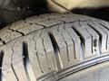 Close-up of a tire from a 2017 Chevrolet Express showcasing the tread pattern and rubber surface details