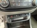 Interior controls of a 2018 Chevrolet Colorado featuring climate control knobs and various buttons for functions like hazard lights and traction control