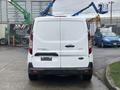 White 2019 Ford Transit Connect viewed from the rear with a blank license plate and a logo on the back door