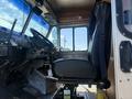 Interior view of a 2009 Workhorse W62 featuring the driver's seat and dashboard with control levers and steering wheel