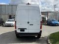 A white 2022 Mercedes-Benz Sprinter van viewed from the rear with the model name and logo visible