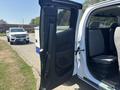 2017 Chevrolet Colorado with an open door revealing the interior seating area and controls