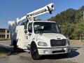 A white 2006 Freightliner M2 106 truck with an elevated work platform and a utility body designed for maintenance and repair tasks