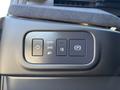 Control panel featuring buttons for auto lights, headlights, fog lights, and electronic parking brake in a 2023 Fisker Ocean
