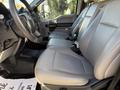 Interior of a 2020 Ford F-550 featuring gray seating with two front bucket seats and a black dashboard