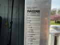 A metal identification plate listing details of a 1996 Kenworth T800 truck including make model and serial number
