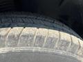 Close-up of a tire tread on a 2022 Mercedes-Benz Sprinter showing visible wear and dirt on the surface