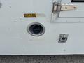 A diesel fuel port on a 2011 Workhorse W62 with a twist cap and a latch for secure closure