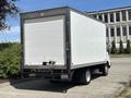 A 2018 Hino 195 truck with a white box cargo area and a gray rear bumper parked in a lot