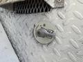 Close-up of a master disconnect switch mounted on a textured metal surface featuring an engraved ON symbol