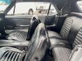 Interior of a 1968 Ford Mustang Two Door Convertible featuring black leather seats with a sporty design and a sleek dashboard
