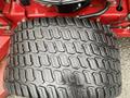 Close-up of a large, rugged tire from a 2017 Ferris Rotary featuring deep treads designed for traction and durability