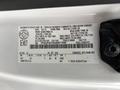 2018 Ford F-550 with a vehicle identification label displaying specifications and manufacturing information