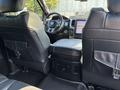 Interior view of a 2018 RAM 3500 showing the back seats and center console with touch screen display