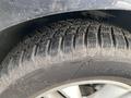 Close-up of a 2017 Ford Edge tire with a detailed tread pattern showing good grip and a size of 245/60R18