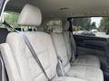 Interior of a 2014 Honda Odyssey with gray fabric seats and seat belts visible in a minivan configuration