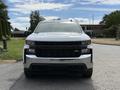 A 2019 Chevrolet Silverado 1500 with a chrome grille and black accents facing directly towards the viewer