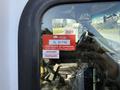 A 2017 Chevrolet Express with a visible inspection sticker showing the year 2027 and a certificate of approval for January and February.
