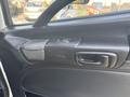 Interior door panel of a 2012 Hino 338 featuring a door handle and control switch for the window