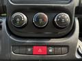 Close-up of the control panel in a 2017 RAM Promaster featuring knobs for climate control and buttons for various functions