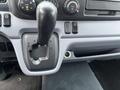 The gear shift of a 2012 Mitsubishi Fuso FE with markings for park reverse neutral drive and manual modes