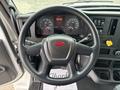 Steering wheel of a 2025 Peterbilt 536 with dashboard displays showing speedometer and gauges