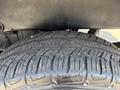 A close-up of a tire from a 2017 Chevrolet Colorado showcasing its tread pattern and texture