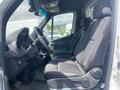 2024 Mercedes-Benz Sprinter interior showing driver's seat passenger seats and dashboard with steering wheel and controls