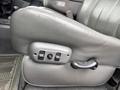A close-up view of the power seat controls on the side of a 2006 Dodge Ram 2500's front seat