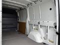 Interior view of a 2017 Mercedes-Benz Sprinter cargo van showing the empty cargo area with wooden paneling and metal surfaces