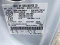 A 2014 Ford F-350 SD truck identification label displaying specifications including gross weight and tire information