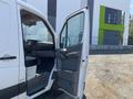 A 2016 Mercedes-Benz Sprinter van with an open front door showing the driver's seat and dashboard area