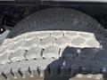 Close-up of a tire tread on a 2014 Freightliner M2 106 showing distinct patterns and wear on the surface