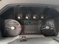 The dashboard of a 2012 Ford F-550 showing speedometer tachometer fuel gauge and odometer with various indicators